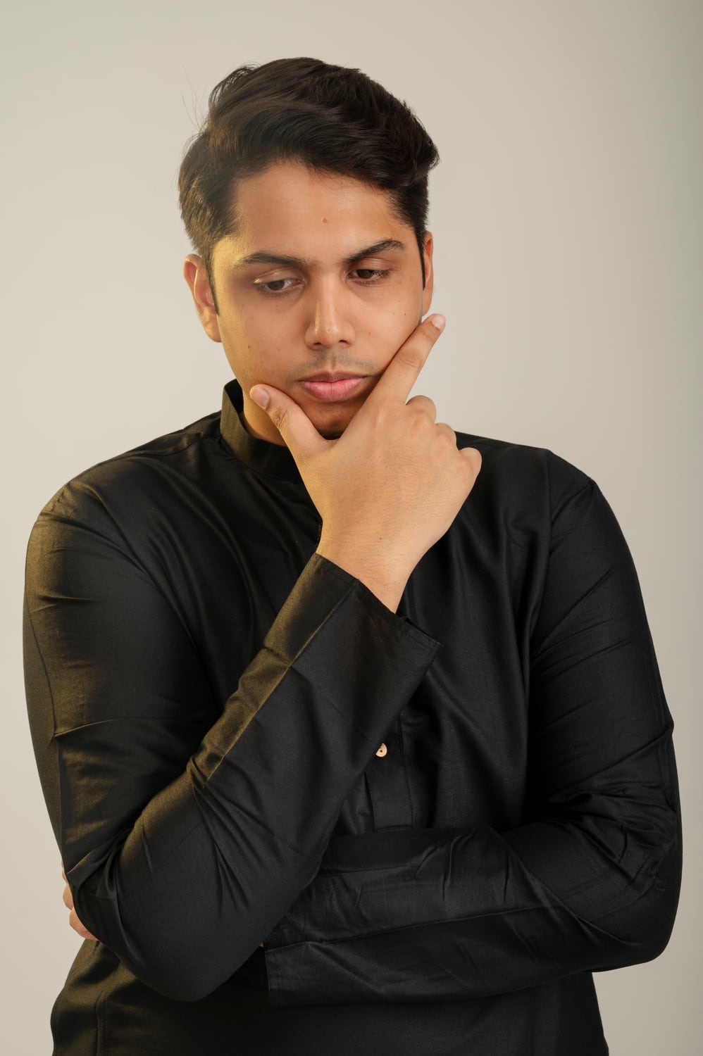 Creative portrait against a coloured studio background