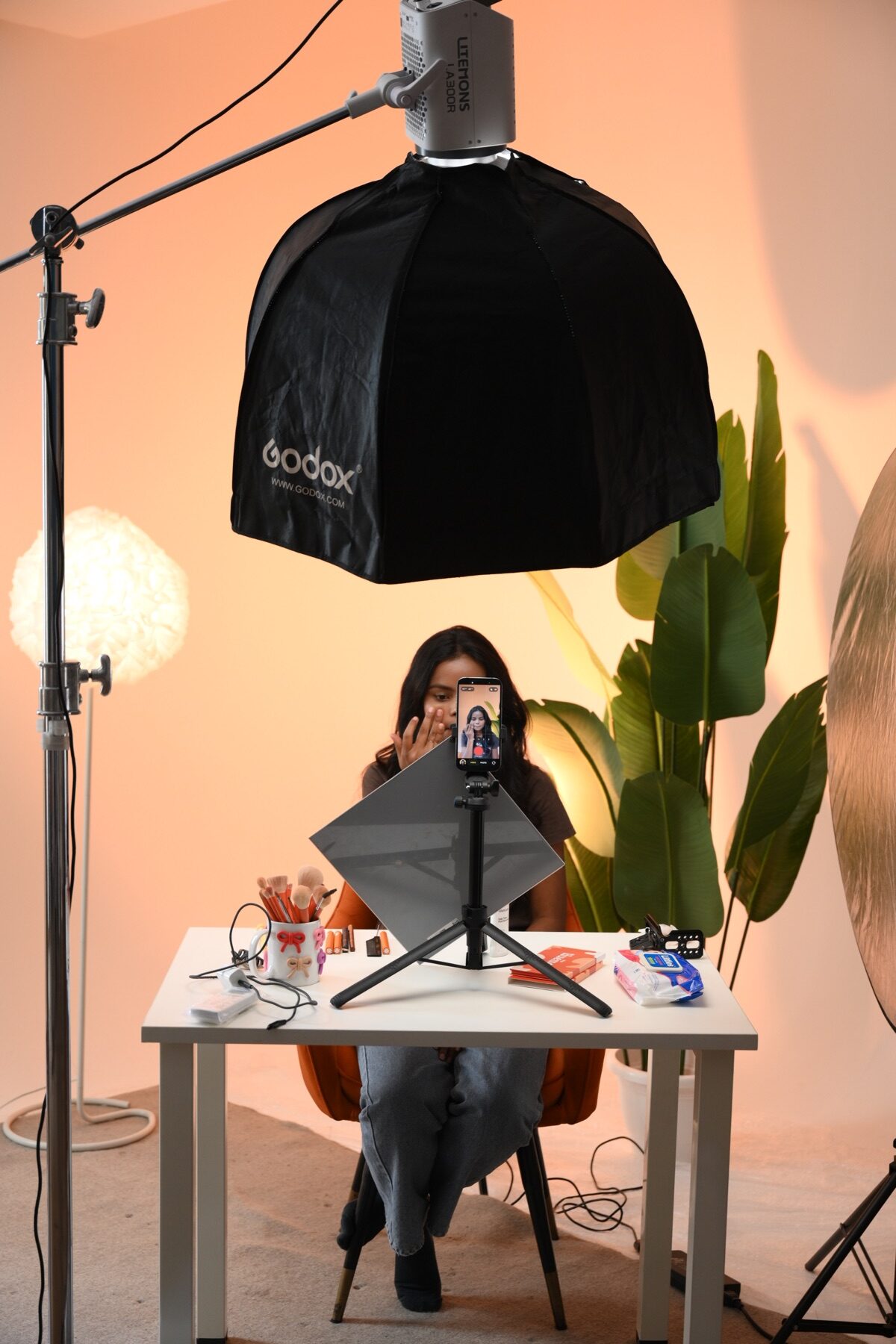 Model preparing on a complete studio set beneath professional lighting for a Delhi NCR fashion shoot