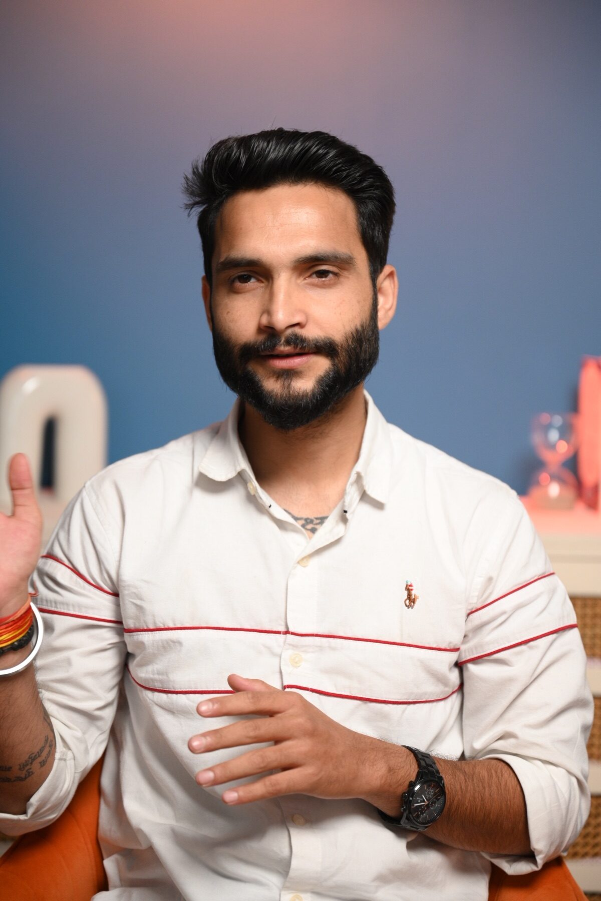 Male model framed in a clean portrait setup for a professional portfolio shoot in Noida