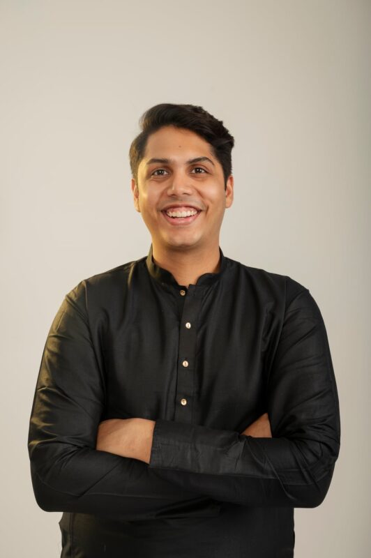 Finished professional studio portrait of a man in a black kurta with arms crossed at Sooper Studios in Noida