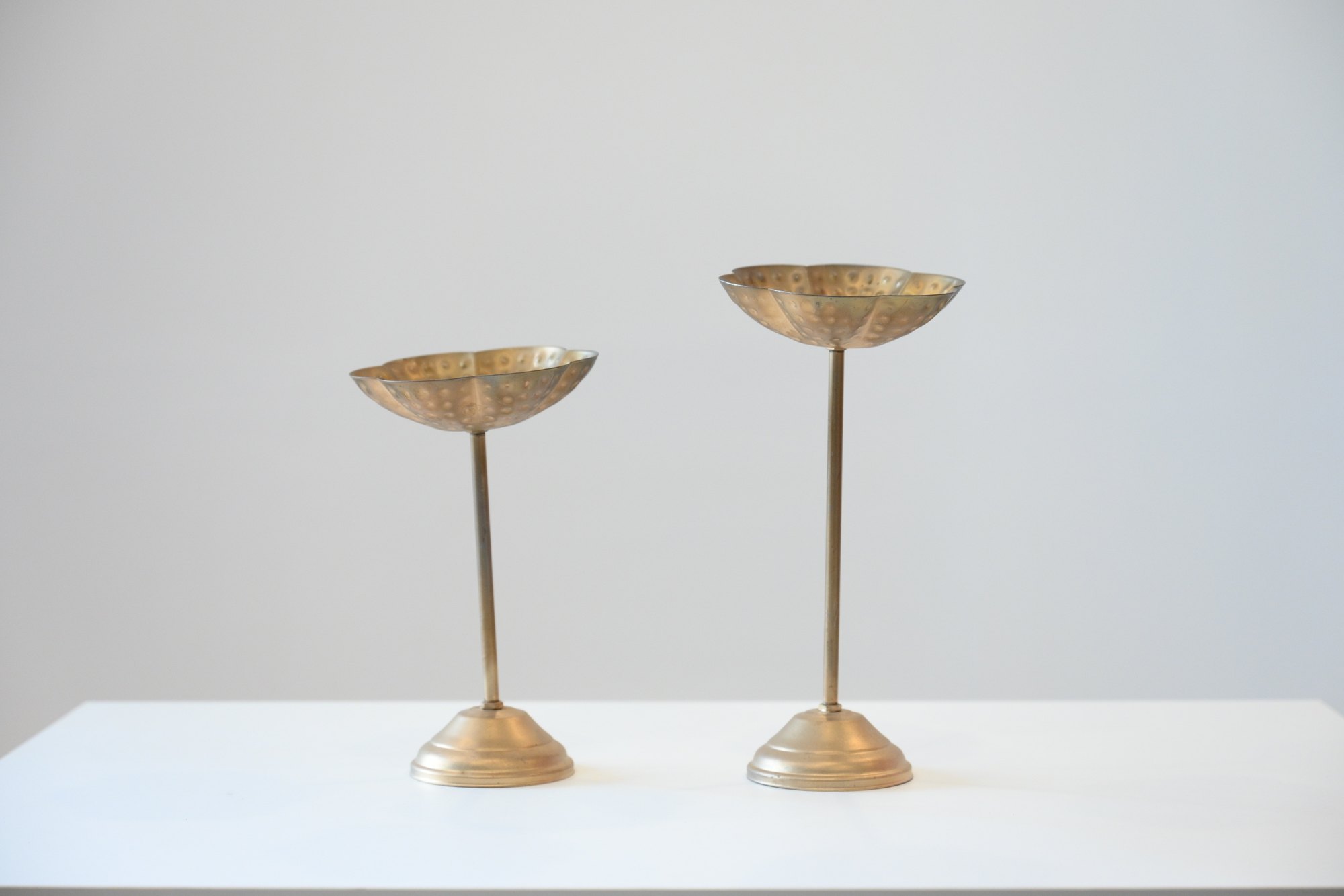 Brass pedestal candleholders