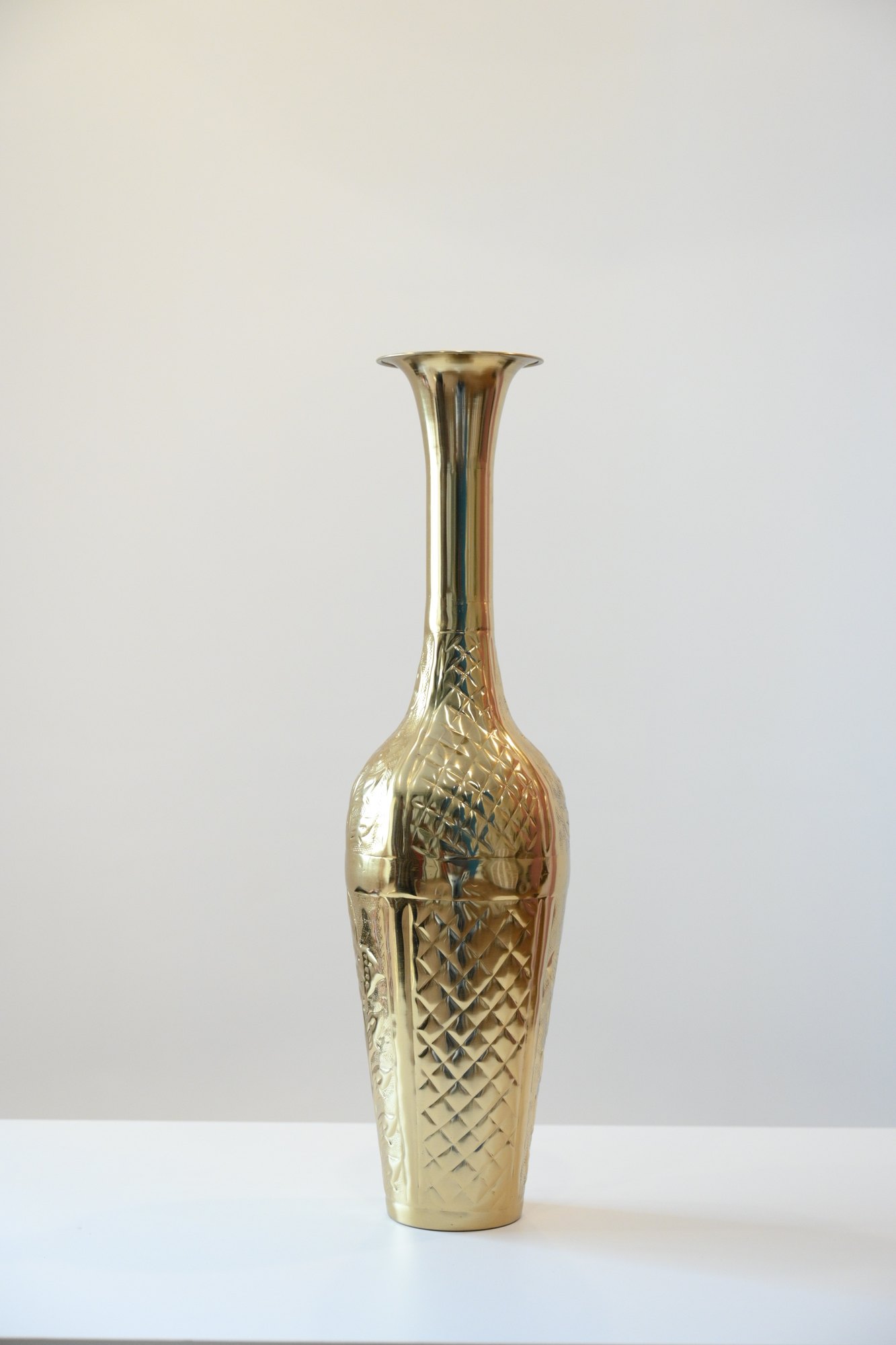 Tall brass vase