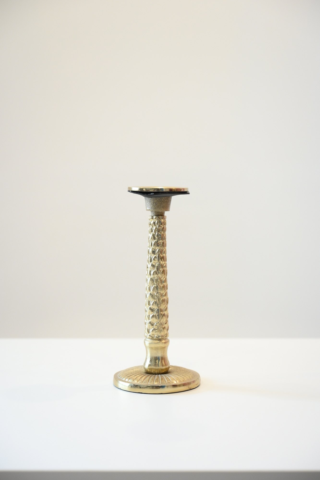Textured brass candle stand