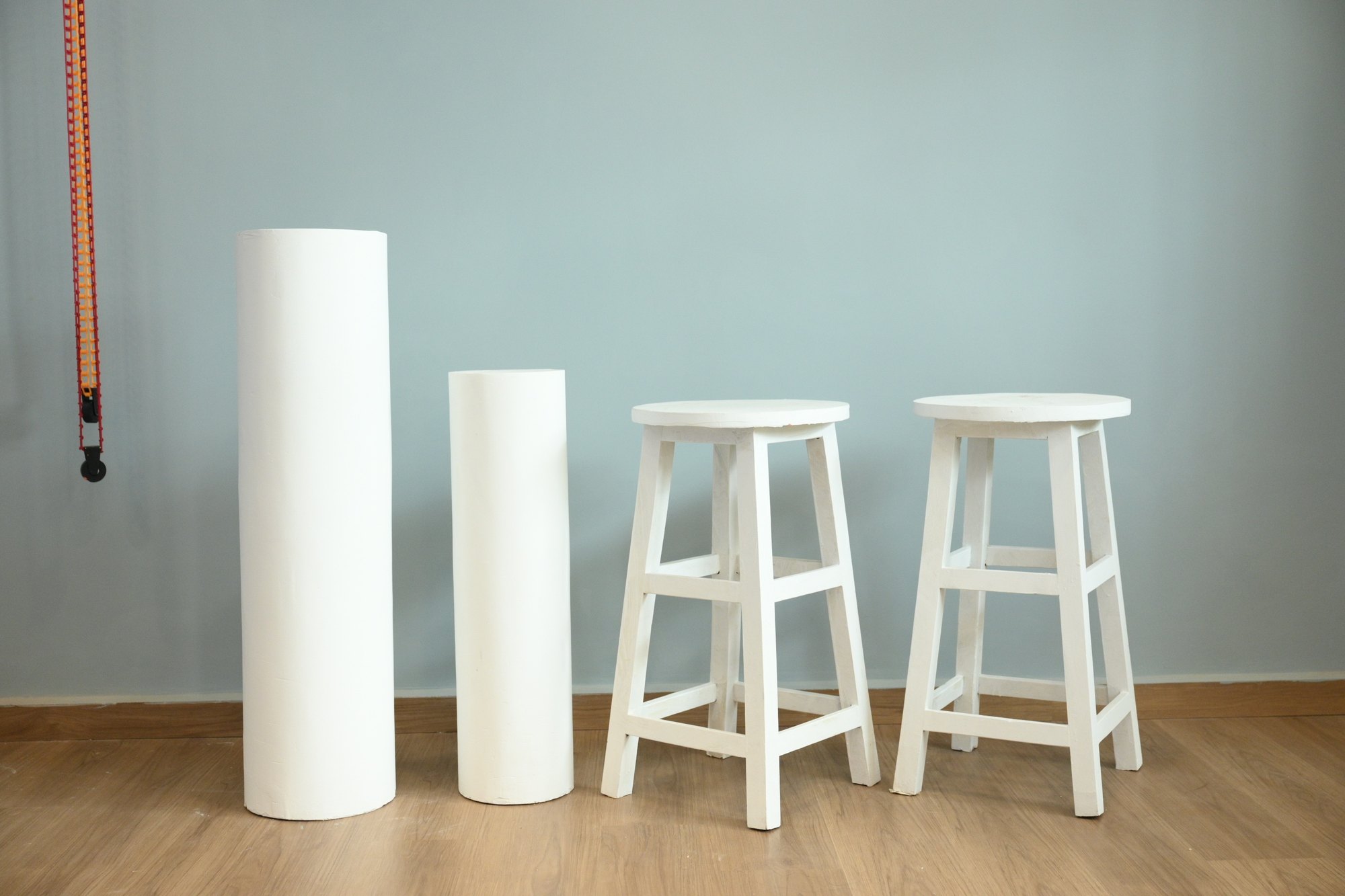 White cylinders and stools