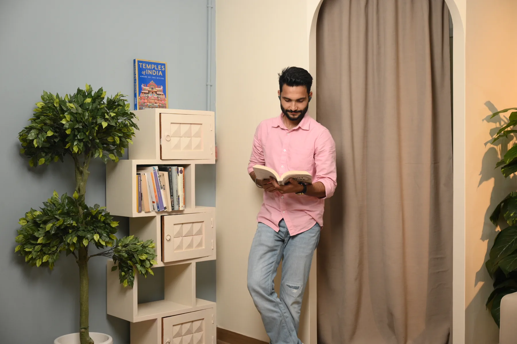 Arch and bookshelf portrait set with a person at Sooper Studios Noida