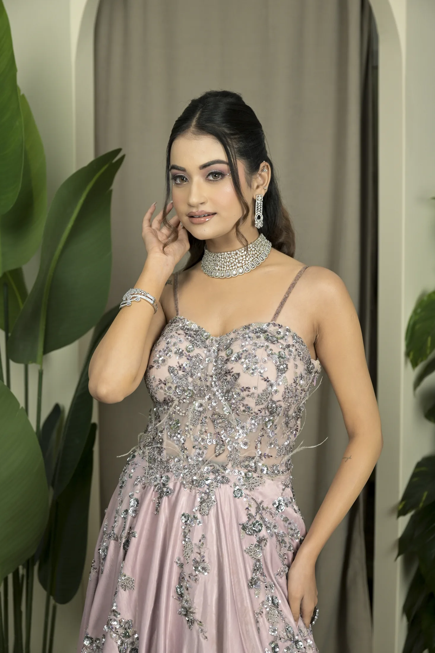 Model in a silver embellished gown photographed at Sooper Studios in Noida