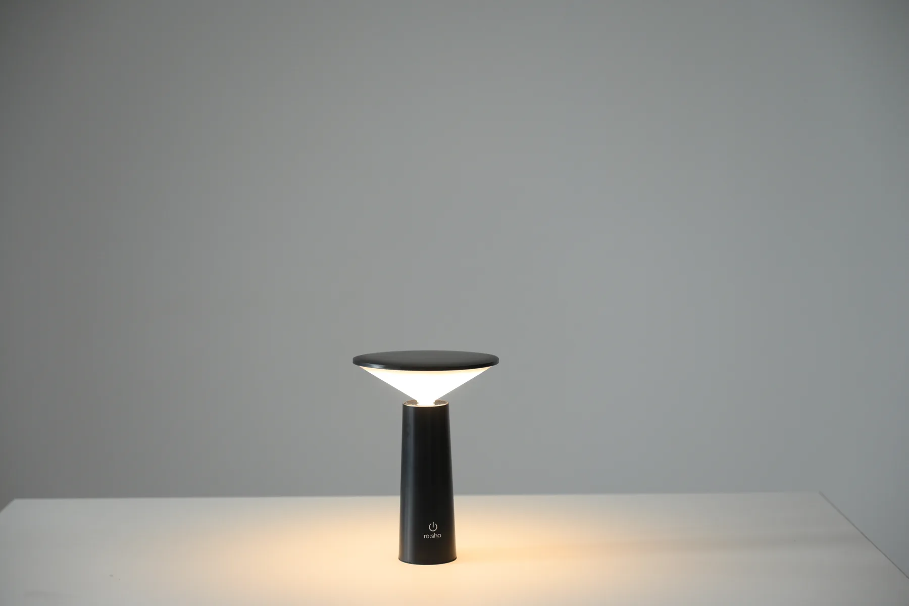 Black rechargeable table lamp available as a studio prop