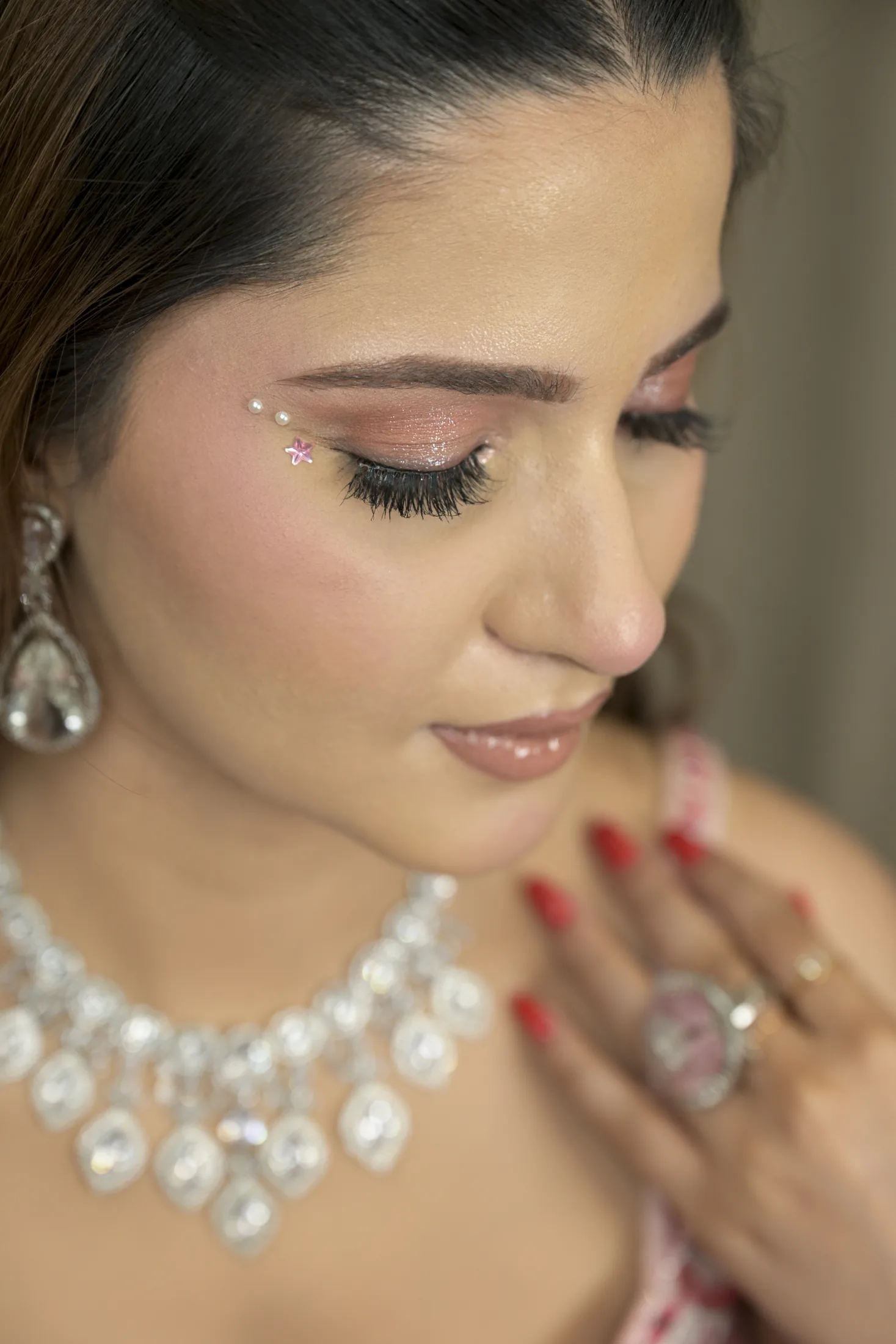 Close-up beauty portrait showing pink eye makeup and jewellery at Sooper Studios