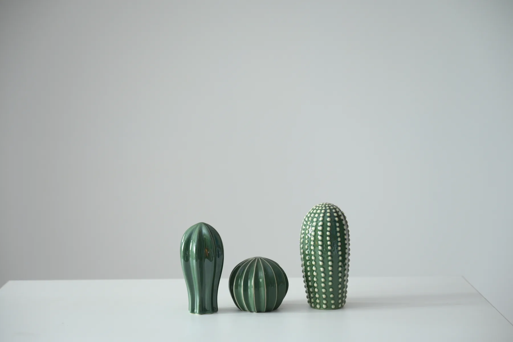 Trio of green cactus ornaments available as studio props