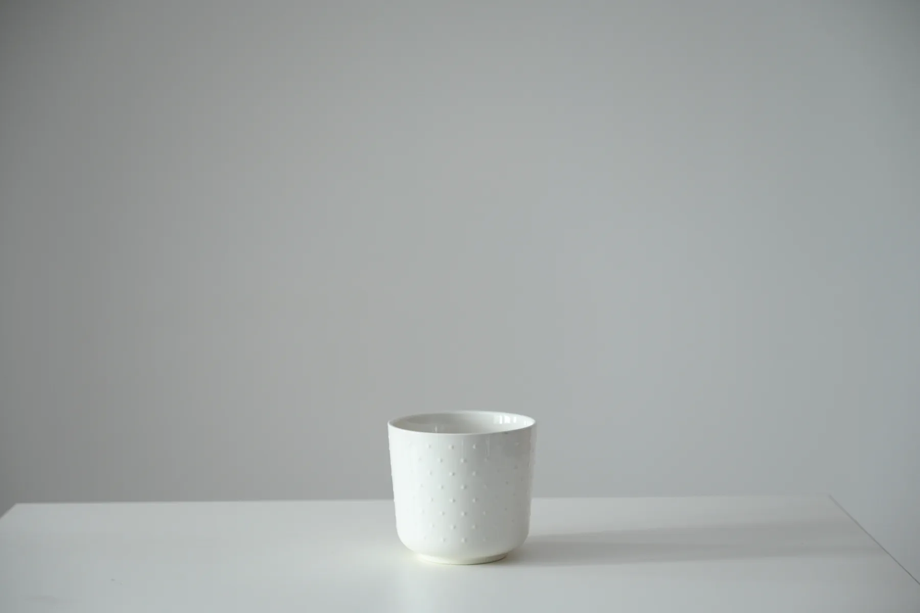 White textured ceramic planter available as a studio prop